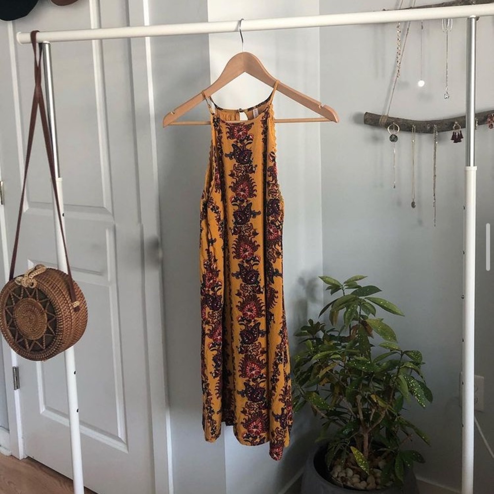 Yellow sun dress with flower pattern